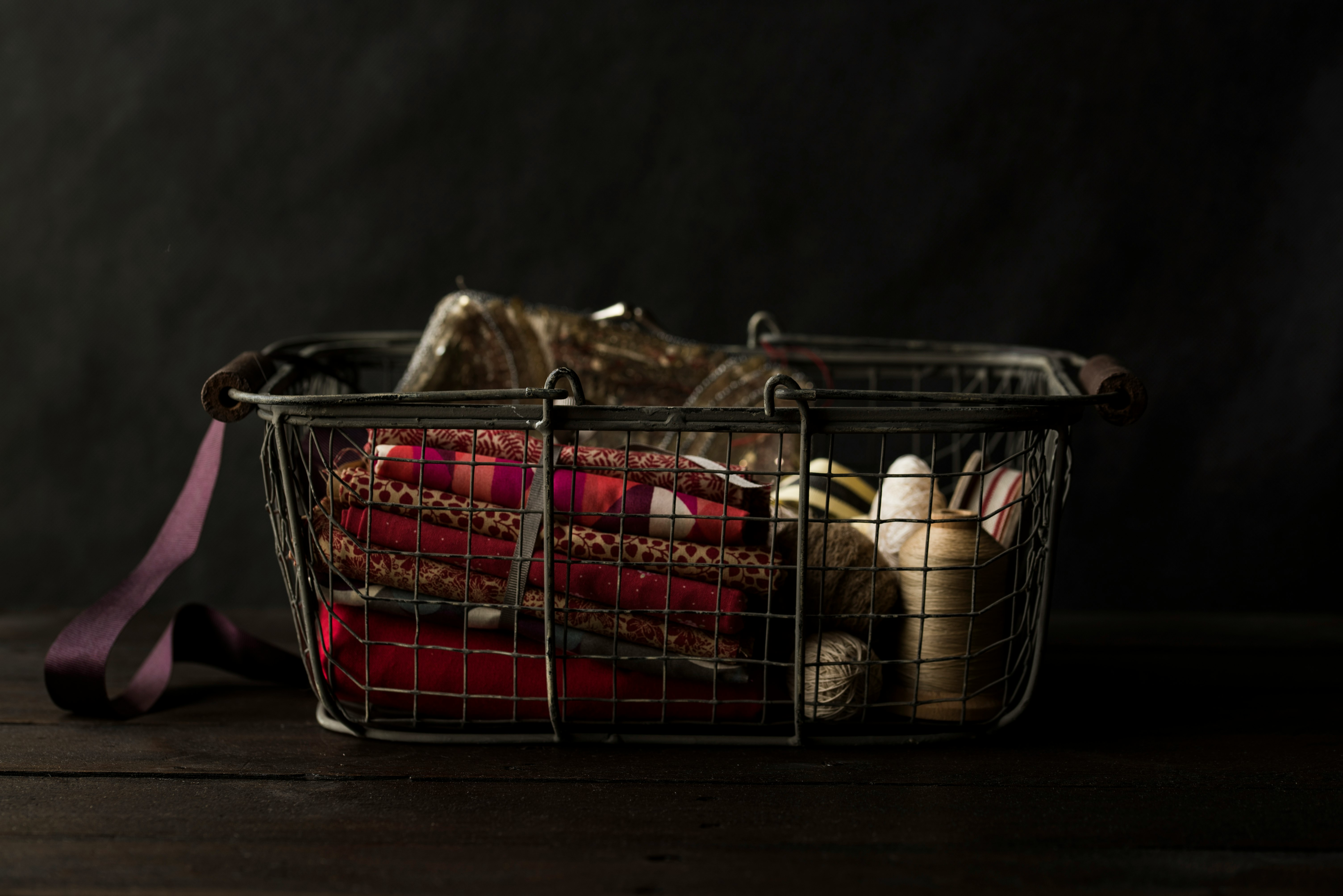 red textile on black steel basket